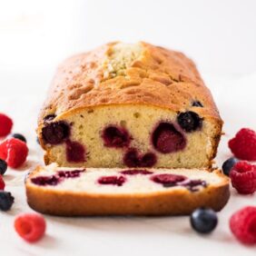 Blueberry raspberry pound cake slice inside of cake with berries