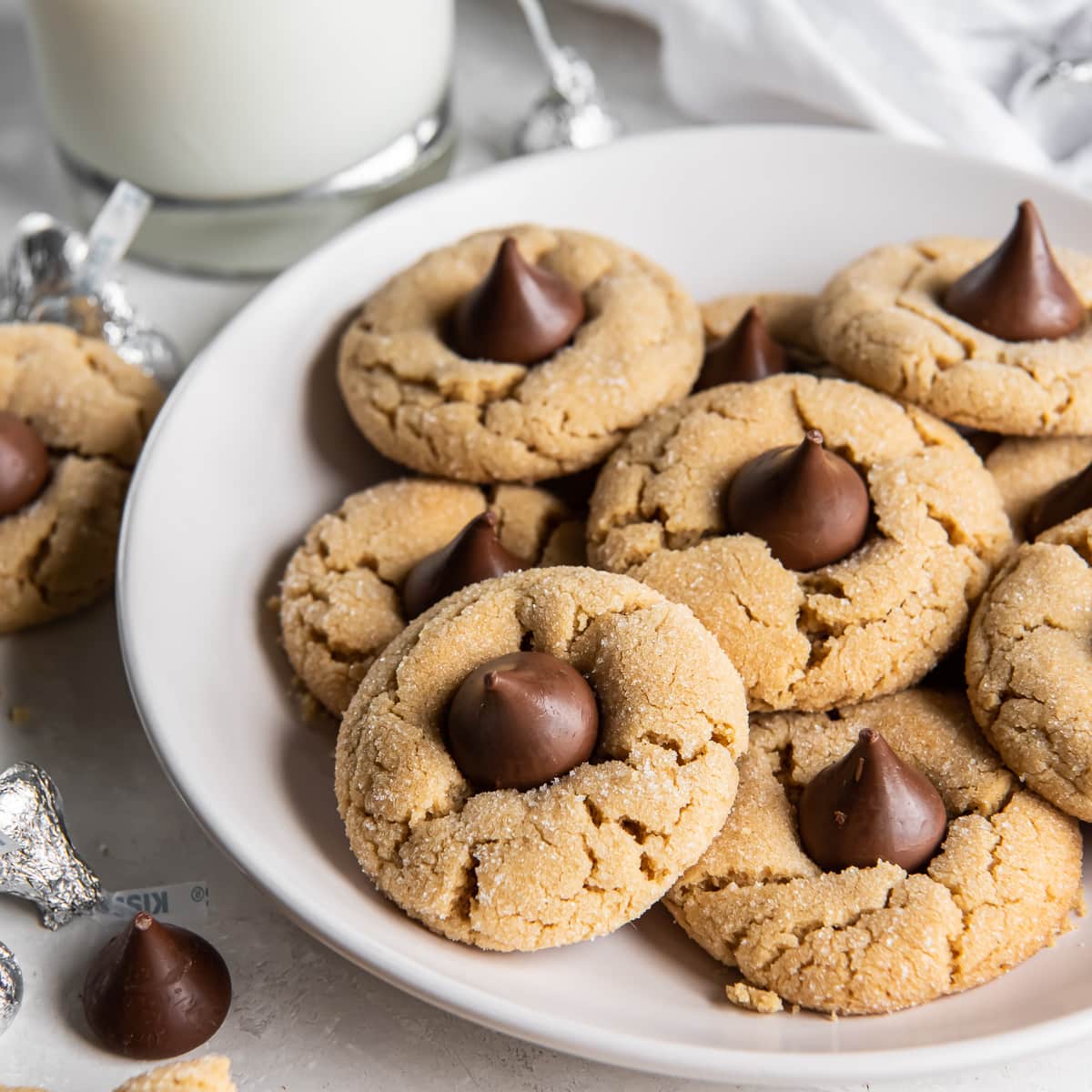 plate of peanut butter blossom cookies with Hershey's kisses.