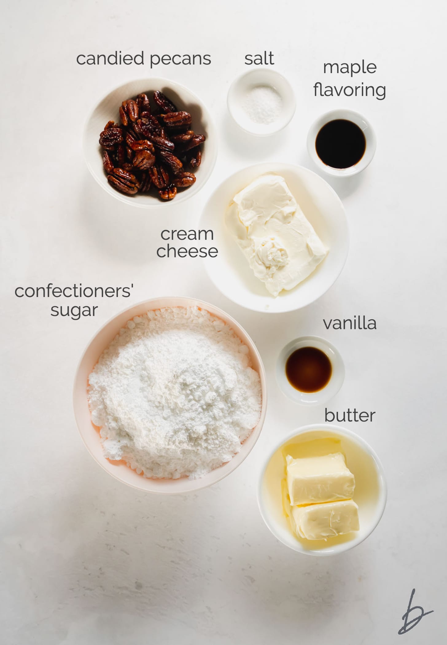 maple cream cheese frosting ingredients in bowls labeled with text