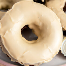 guinness donut with baileys glaze propped on more donuts