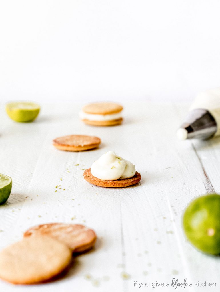 round graham cracker cookies with key lime cream cheese frosting. Cookie sandwiches