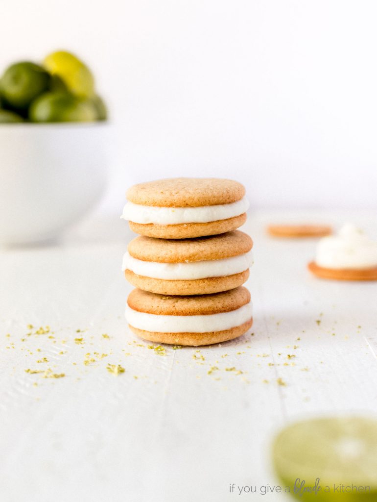 key lime pie cookies stacked on top of each other with lime in a bowl