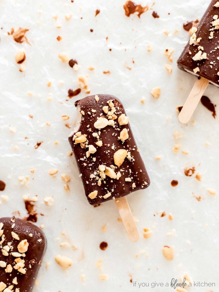 5 ingredient peanut butter chocolate popsicles dipped in chocolate with chopped peanuts