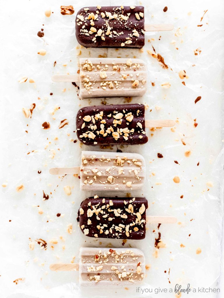 chocolate banana peanut butter popsicles alternating dipped in chocolate