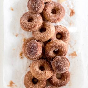 pile of donuts and muffins with cinnamon sugar