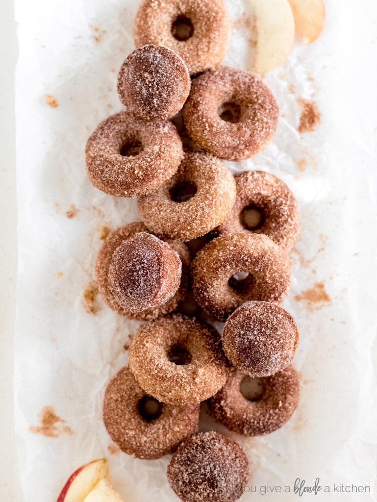 pile of donuts and muffins with cinnamon sugar
