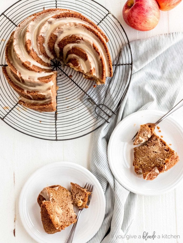 fresh apple bundt cake with slices on plate with forks ready to eat