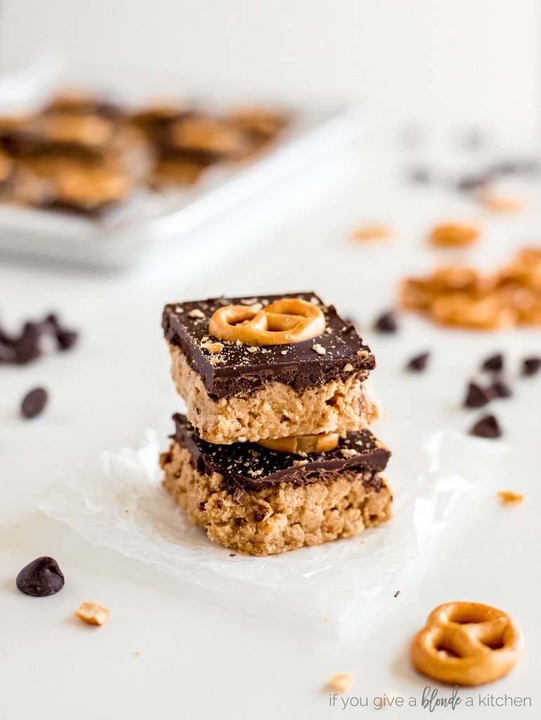 two peanut butter pretzel bars stacked on top of each other