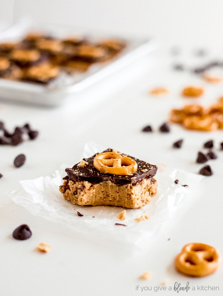 peanut butter pretzel bars with chocolate and bite