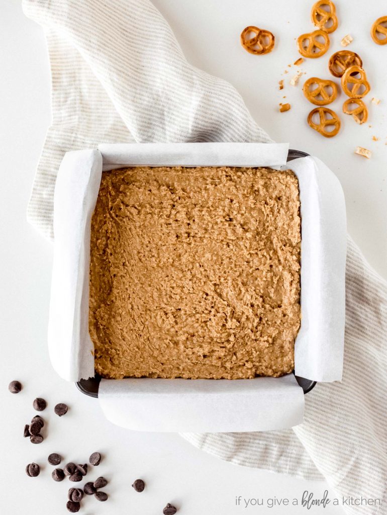 step one no bake peanut butter pretzel base in 8x8 baking pan