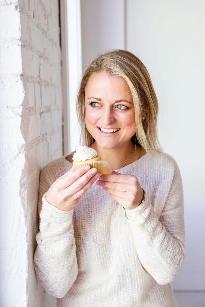 haley blonde baker holding cupcake