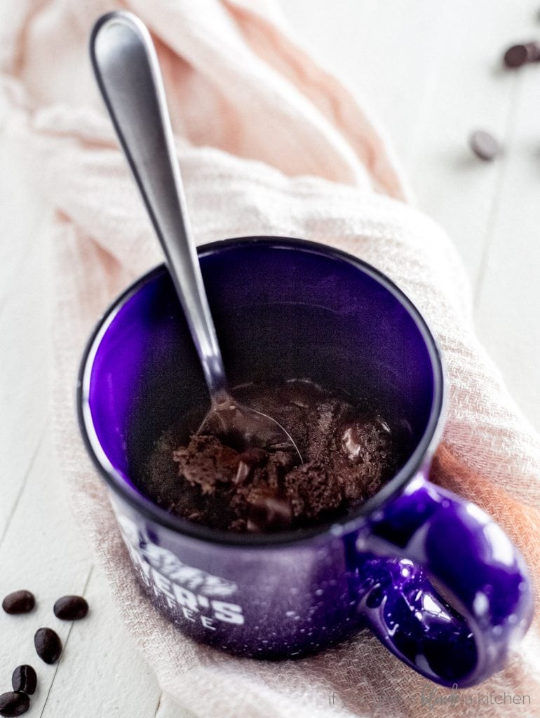 double chocolate chip cookie in a mug with spoon