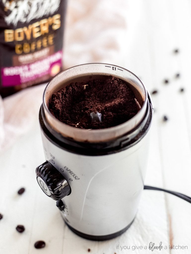 espresso ground coffee in a coffee bean grinder