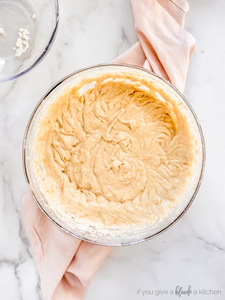 large glass bowl with banana bread batter
