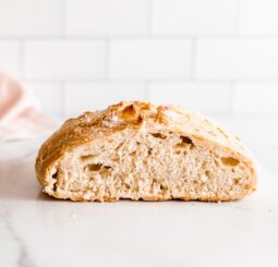 center cut no knead bread on marble countertop