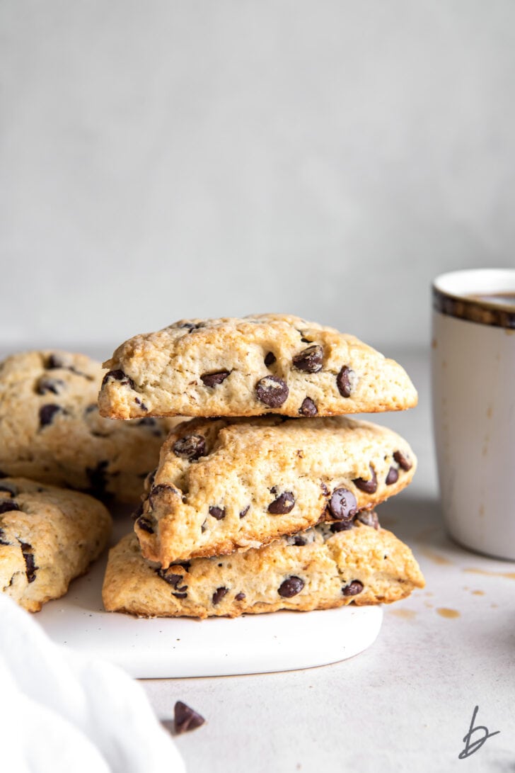 three chocolate chip scones stacked on top of each other