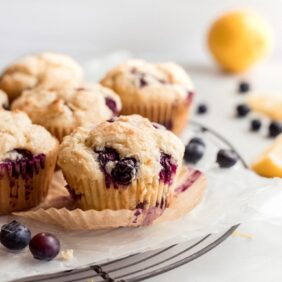blueberry muffin, paper liner unwrapped, round cooling rack