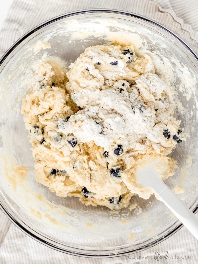 blueberry muffin batter in glass mixing bowl
