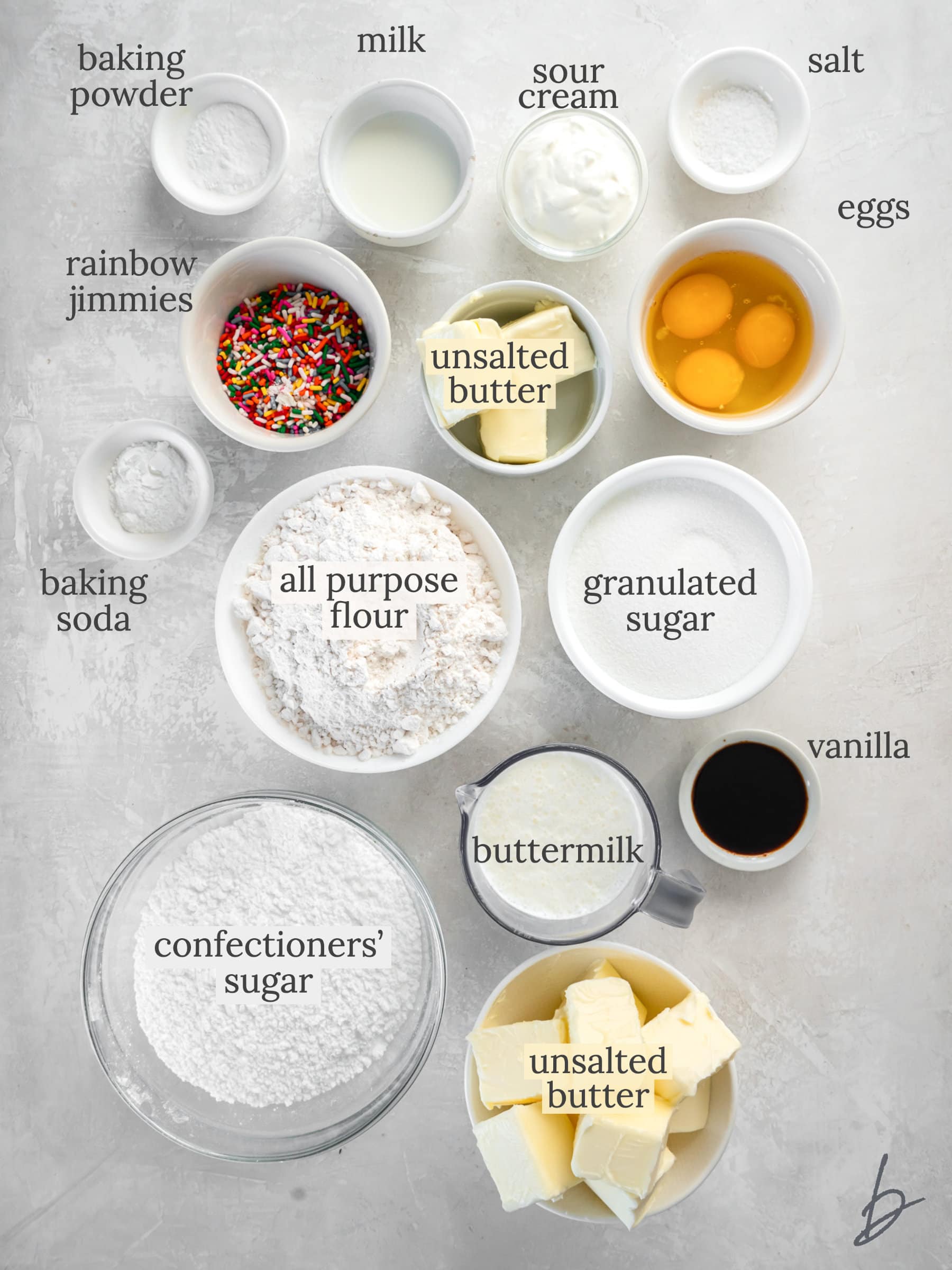 funfetti cake ingredients in bowls labeled with text.