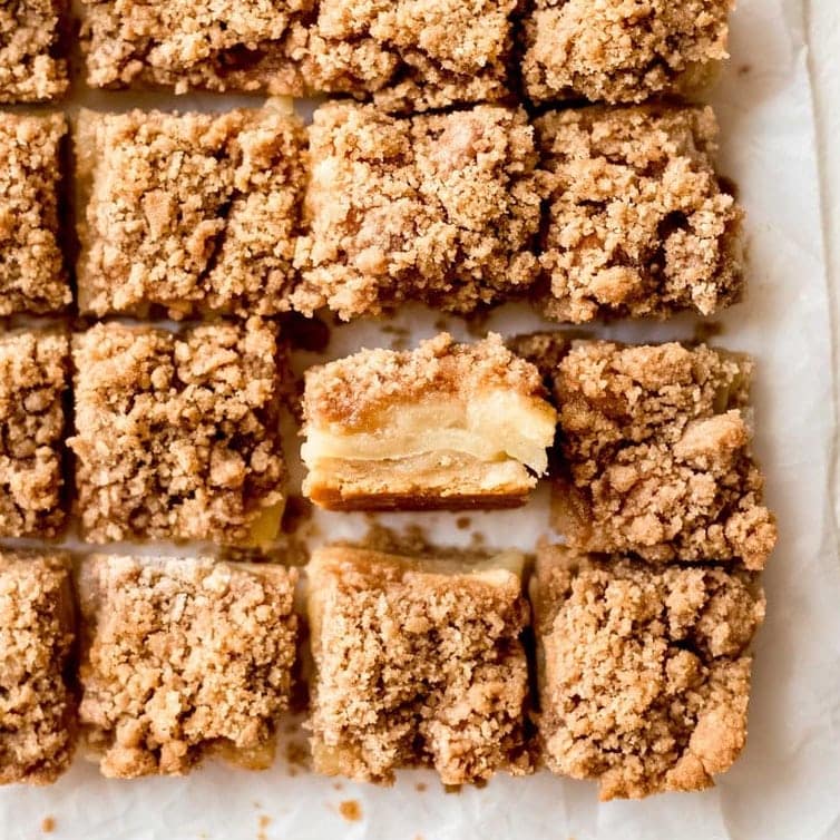 apple crisp bars cut into square with one turned on its side to show apple layers