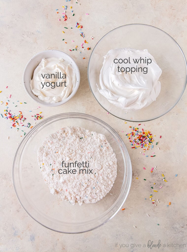 funfetti cake dip ingredients in bowls labeled with text
