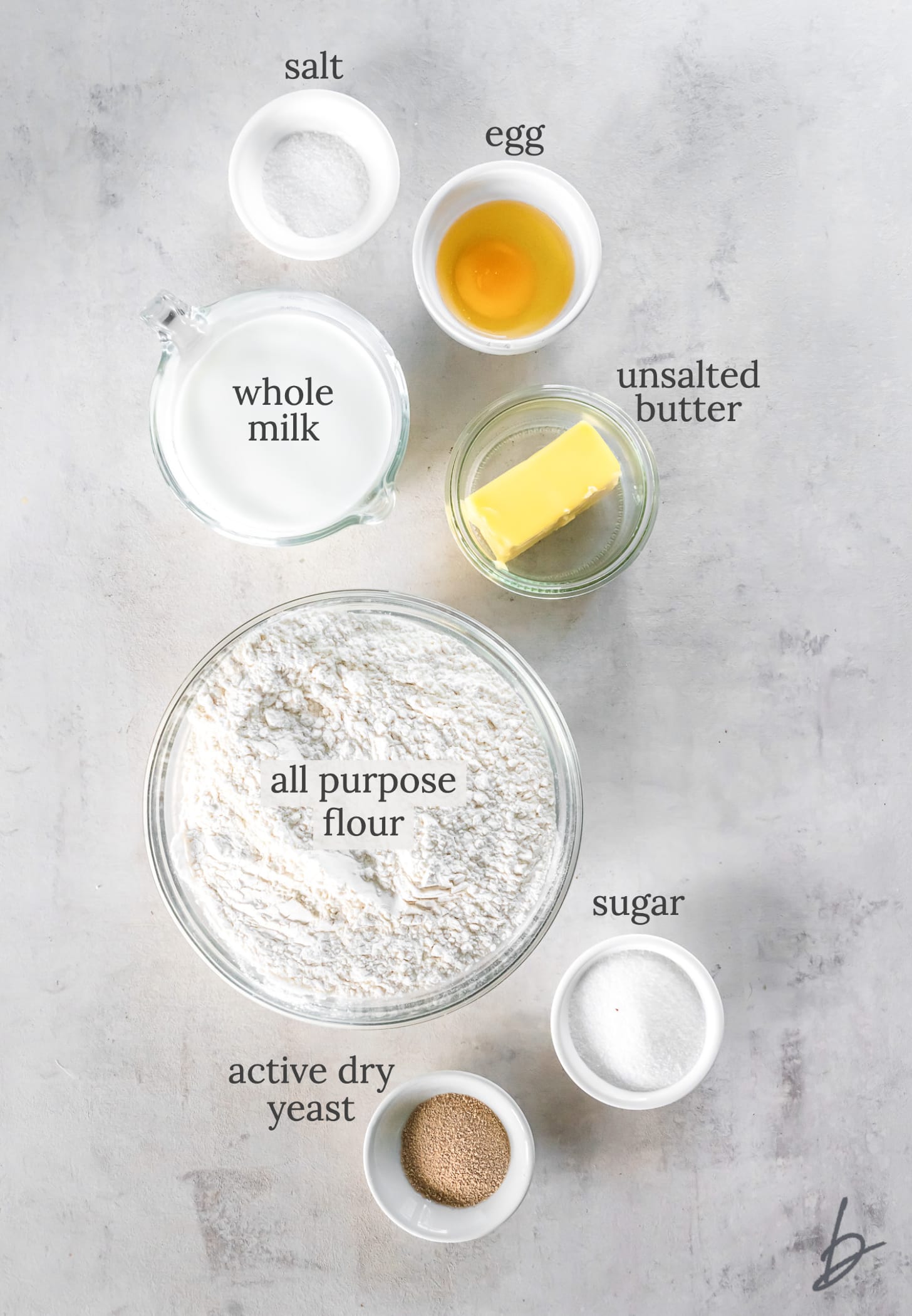 homemade dinner rolls ingredients in bowls labeled with text