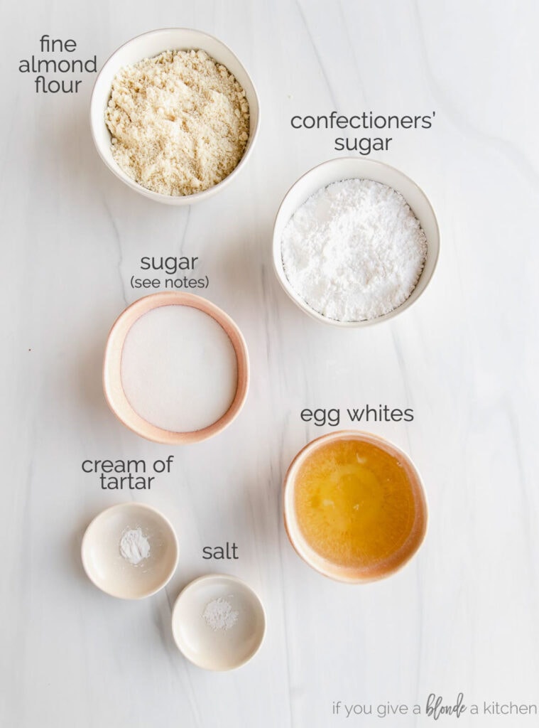 french macaron ingredients in bowls labeled with text