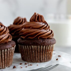 chocolate cupcakes topped with chocolate buttercream frosting