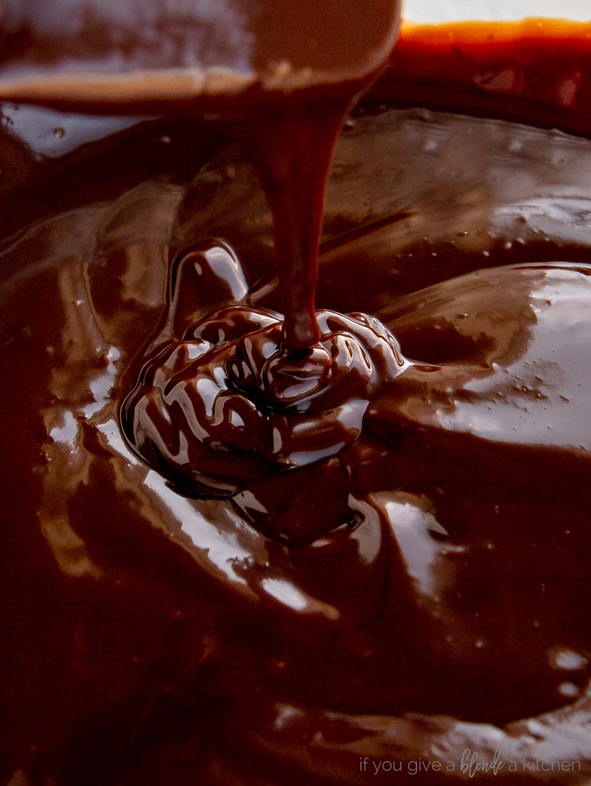 chocolate ganache dripping into bowl