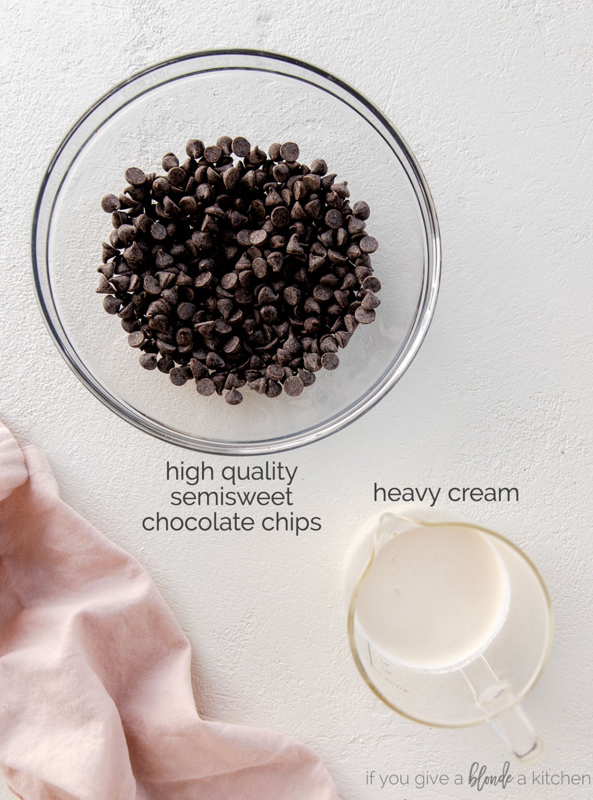 chocolate ganache ingredients: bowl of chocolate chips and glass pitcher of heavy cream