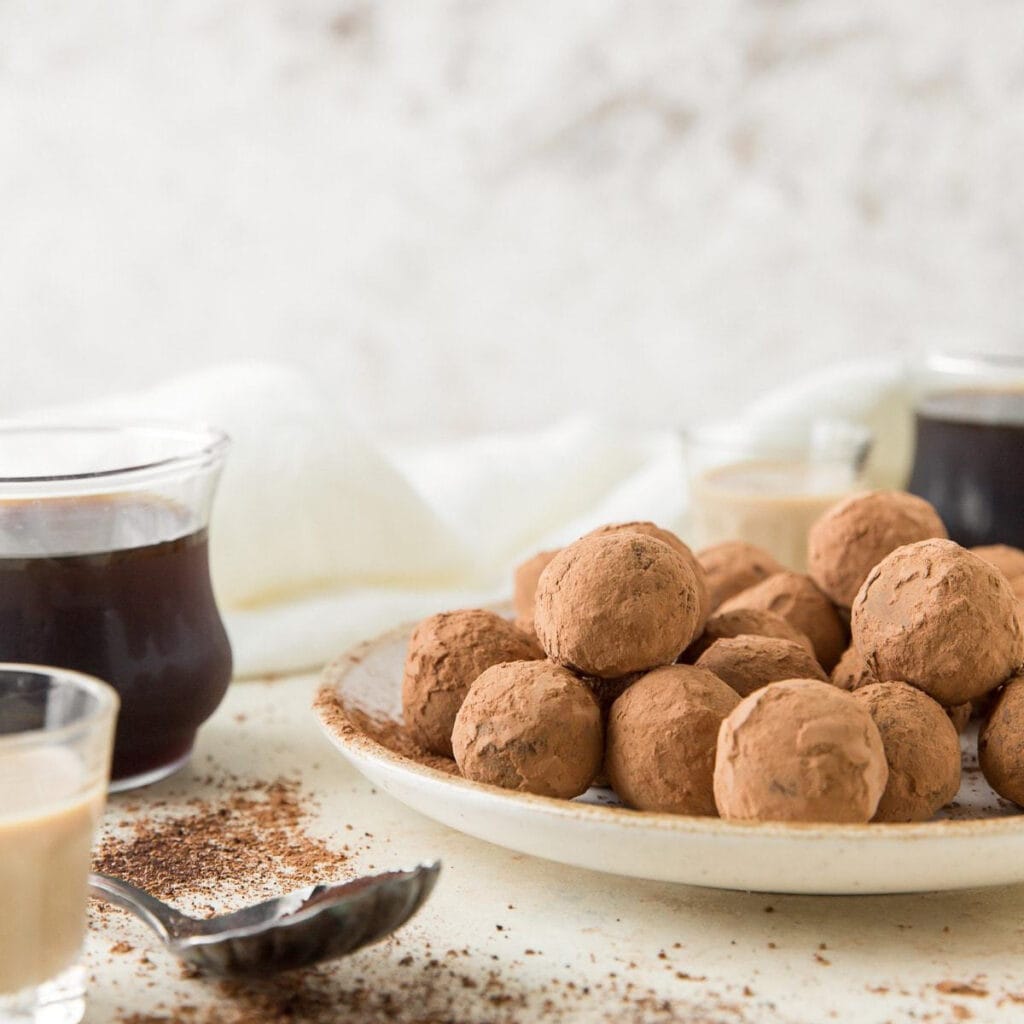 irish cream espresso truffles covered in cocoa powder on a plate