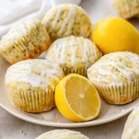 plate of lemon poppy seed muffins and lemon wedges