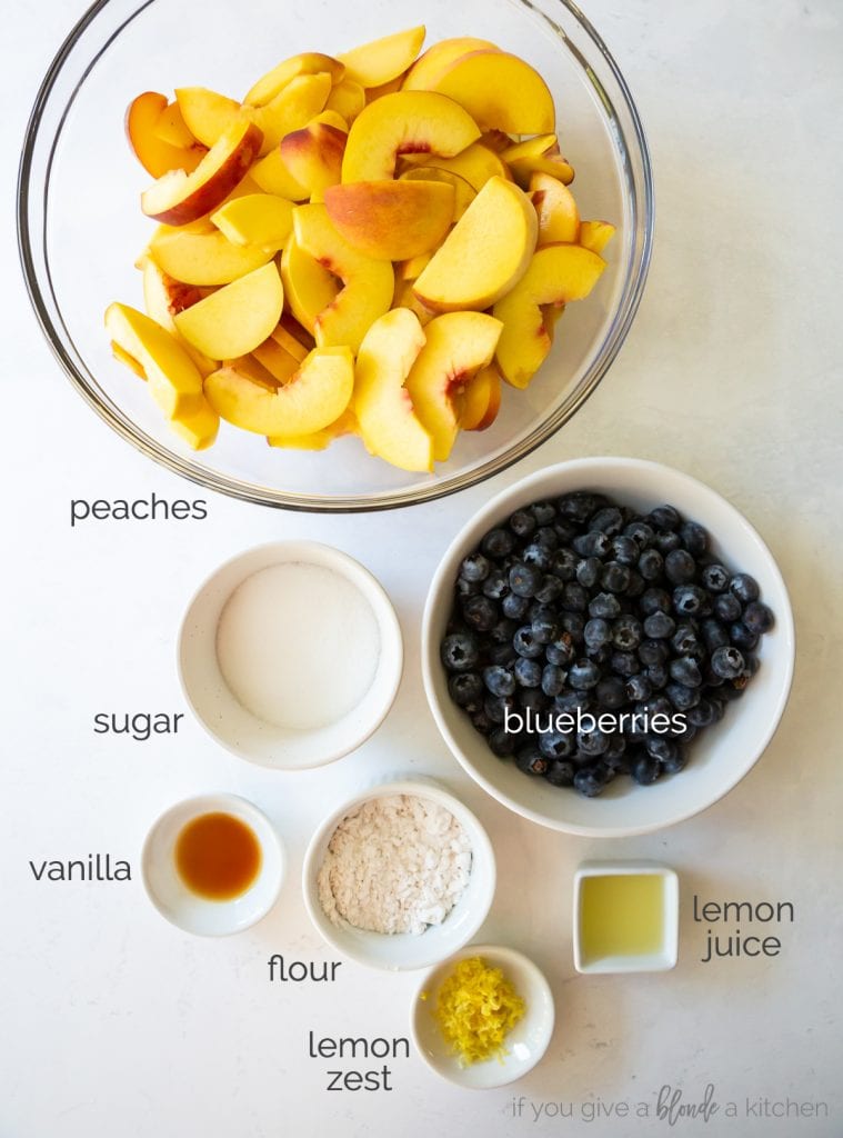 peach blueberry crisp filling ingredients in bowls.