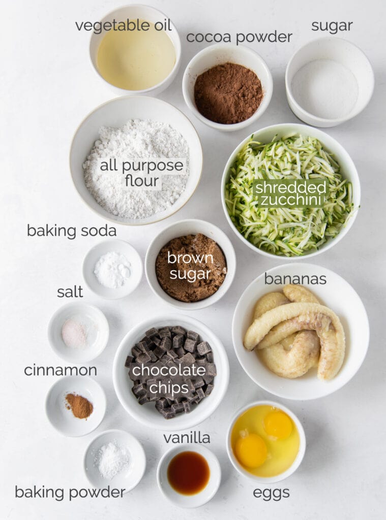 chocolate zucchini banana bread ingredients in bowls with text