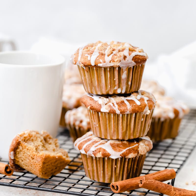 stack of three coffee cake muffins with drizzle of icing