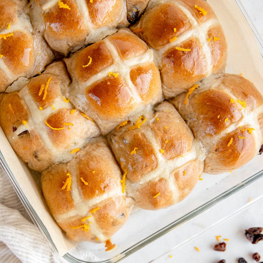 top of hot cross buns in a glass baking dish