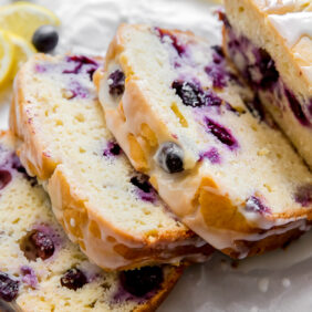 three slices of lemon blueberry bread cut off the loaf