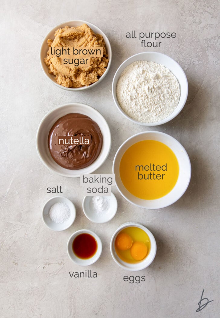 nutella blondie ingredients in bowls labeled with text