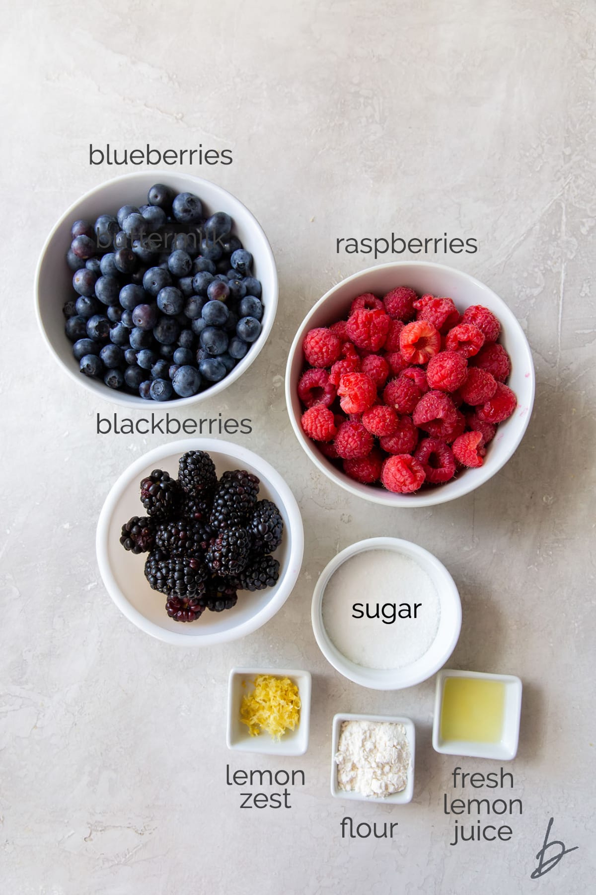 triple berry crisp filling ingredients in bowls labeled with text