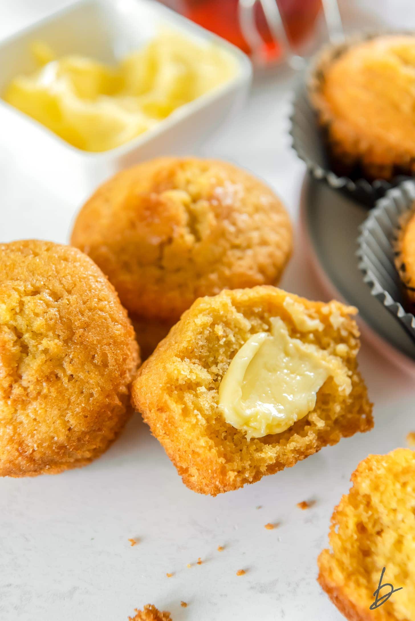 cornbread cut in half with butter spread in the center