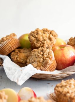basket of apple crumble muffins and honey crisp apples