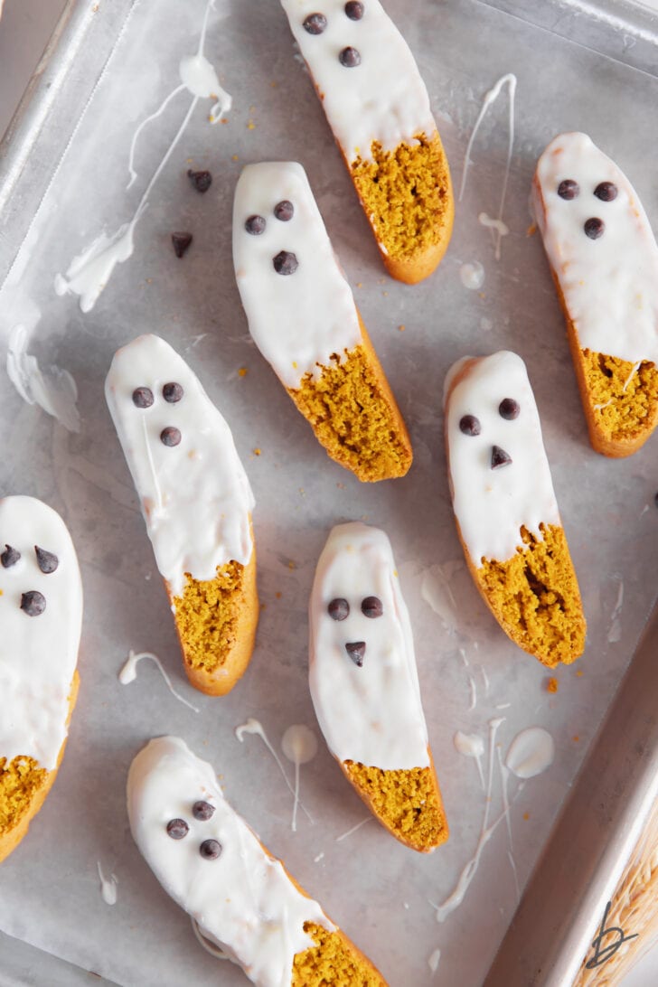 pumpkin biscotti with white chocolate dip and mini chocolate chip face to look like ghosts