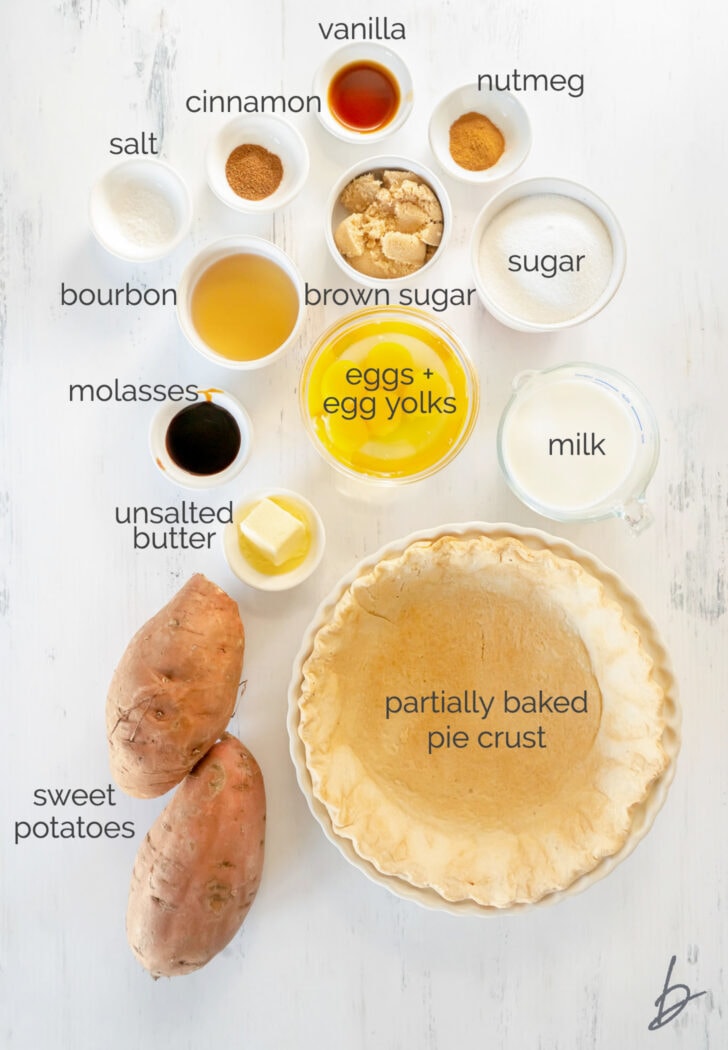 bourbon sweet potato pie ingredients in bowls labeled with text
