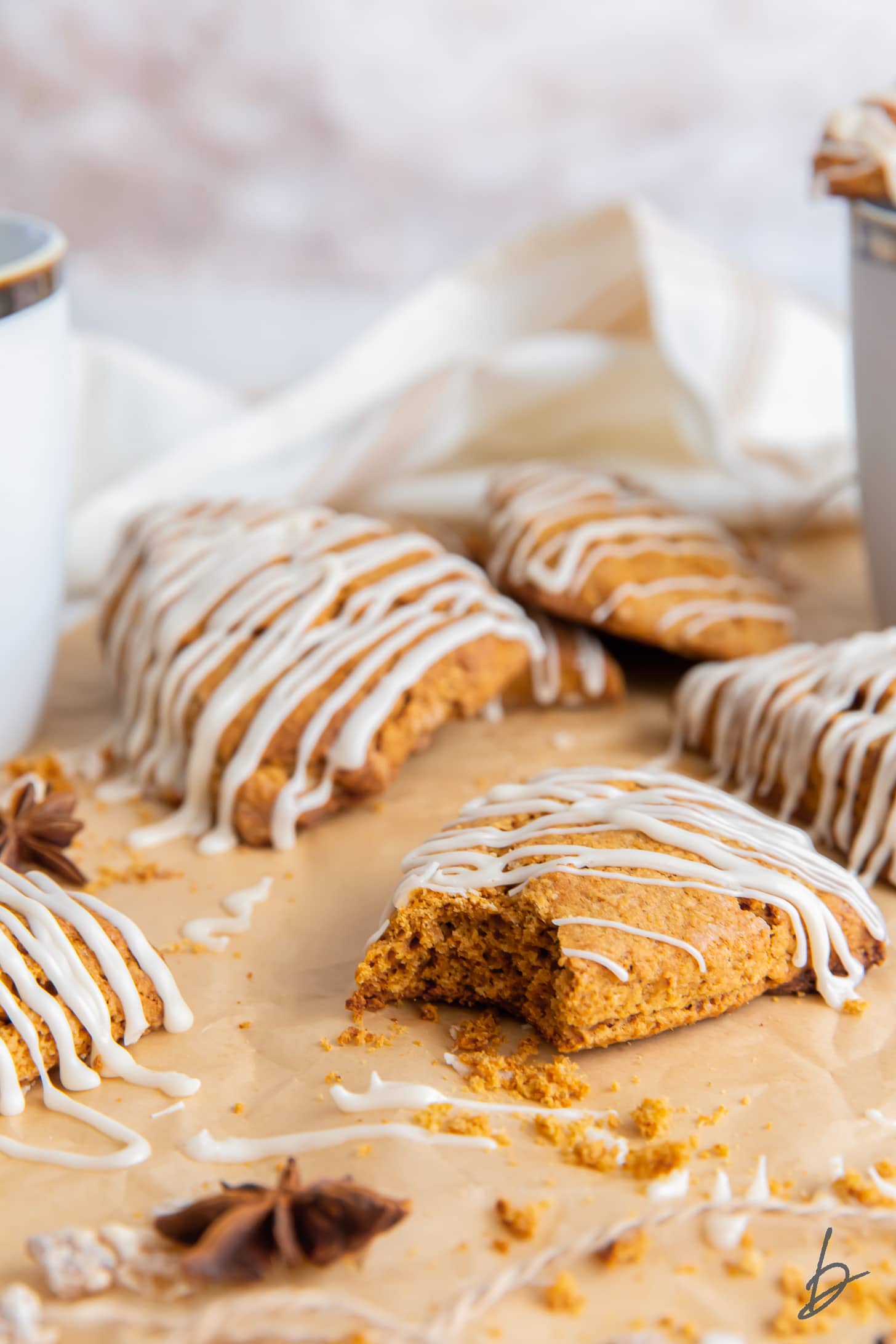 gingerbread scone with a bite and more scones behind it