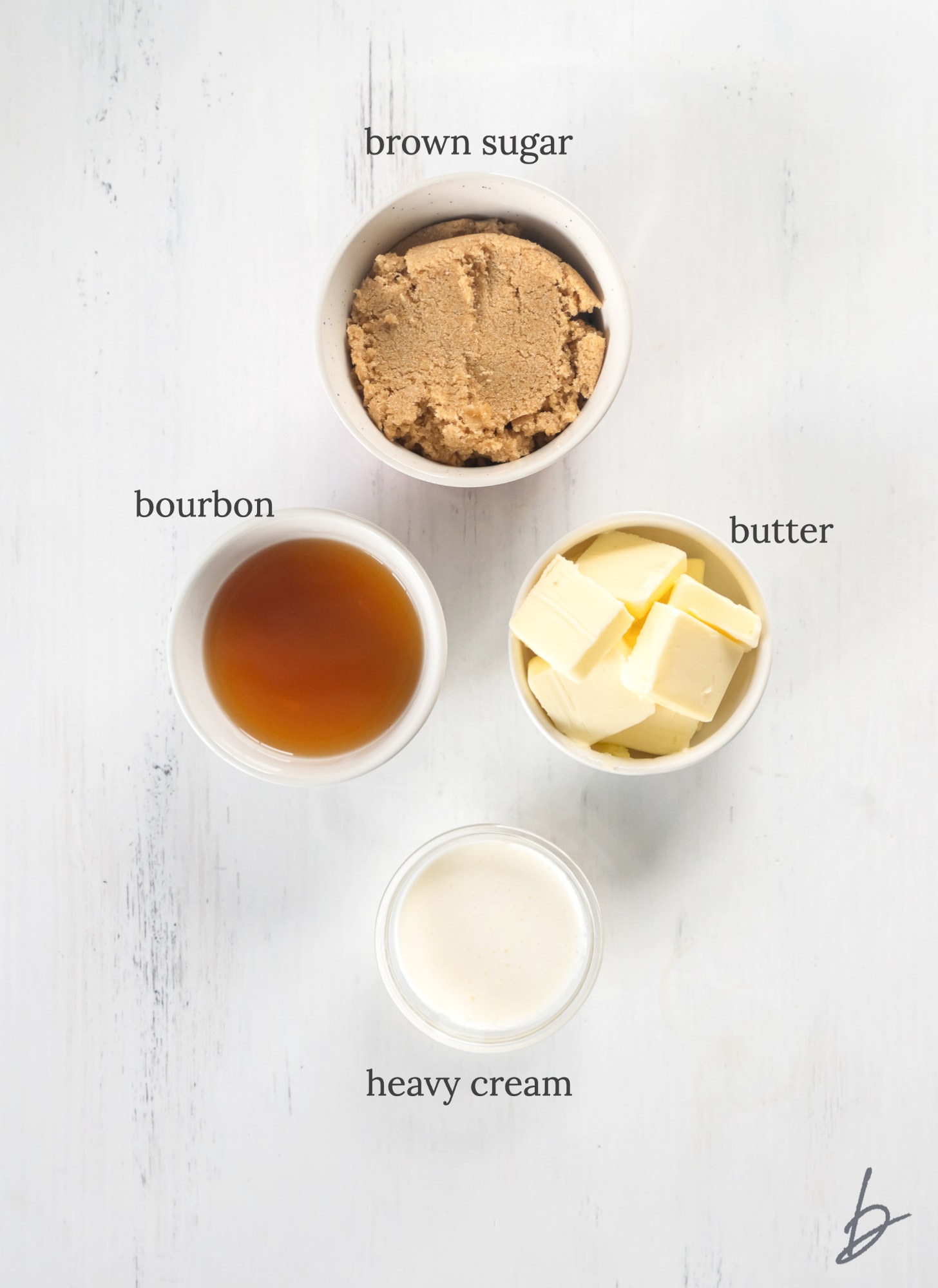 bourbon sauce ingredients in bowls labeled with text