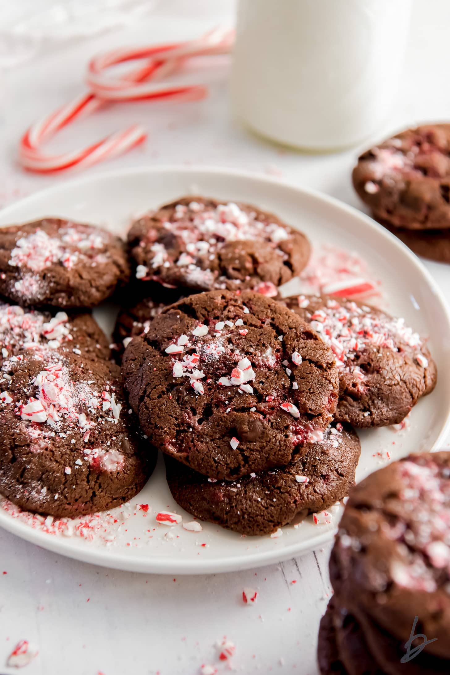 plate of double chocolate peppermint cookies with crushed peppermint sprinkled on top.