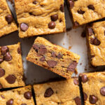 chocolate chip cookie bars cut in square with one bar on its side