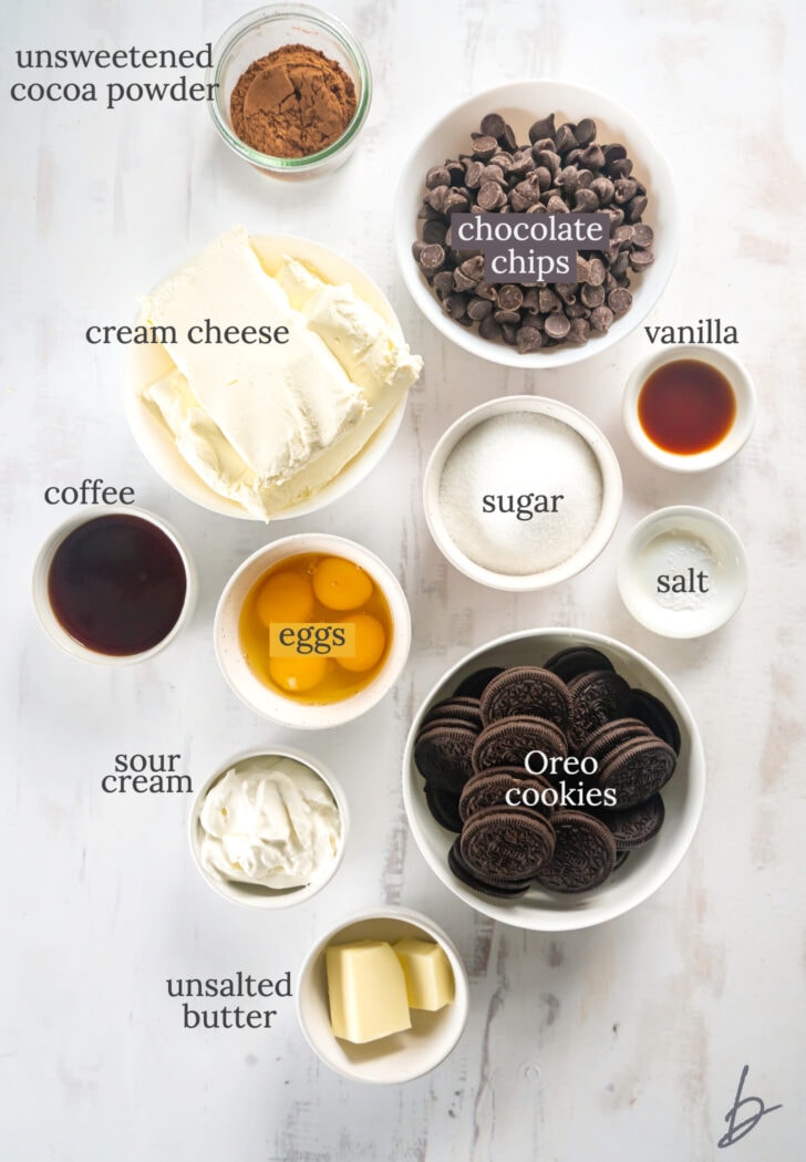 chocolate cheesecake ingredients in bowls labeled with text