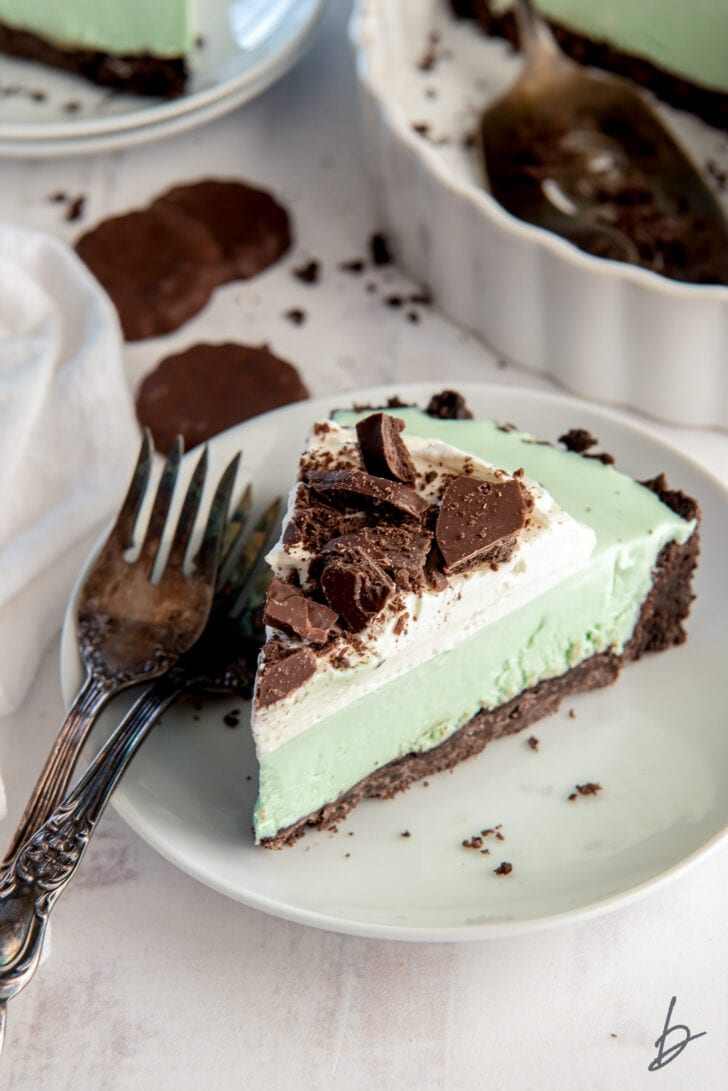 slice of grasshopper pie on a plate with two forks