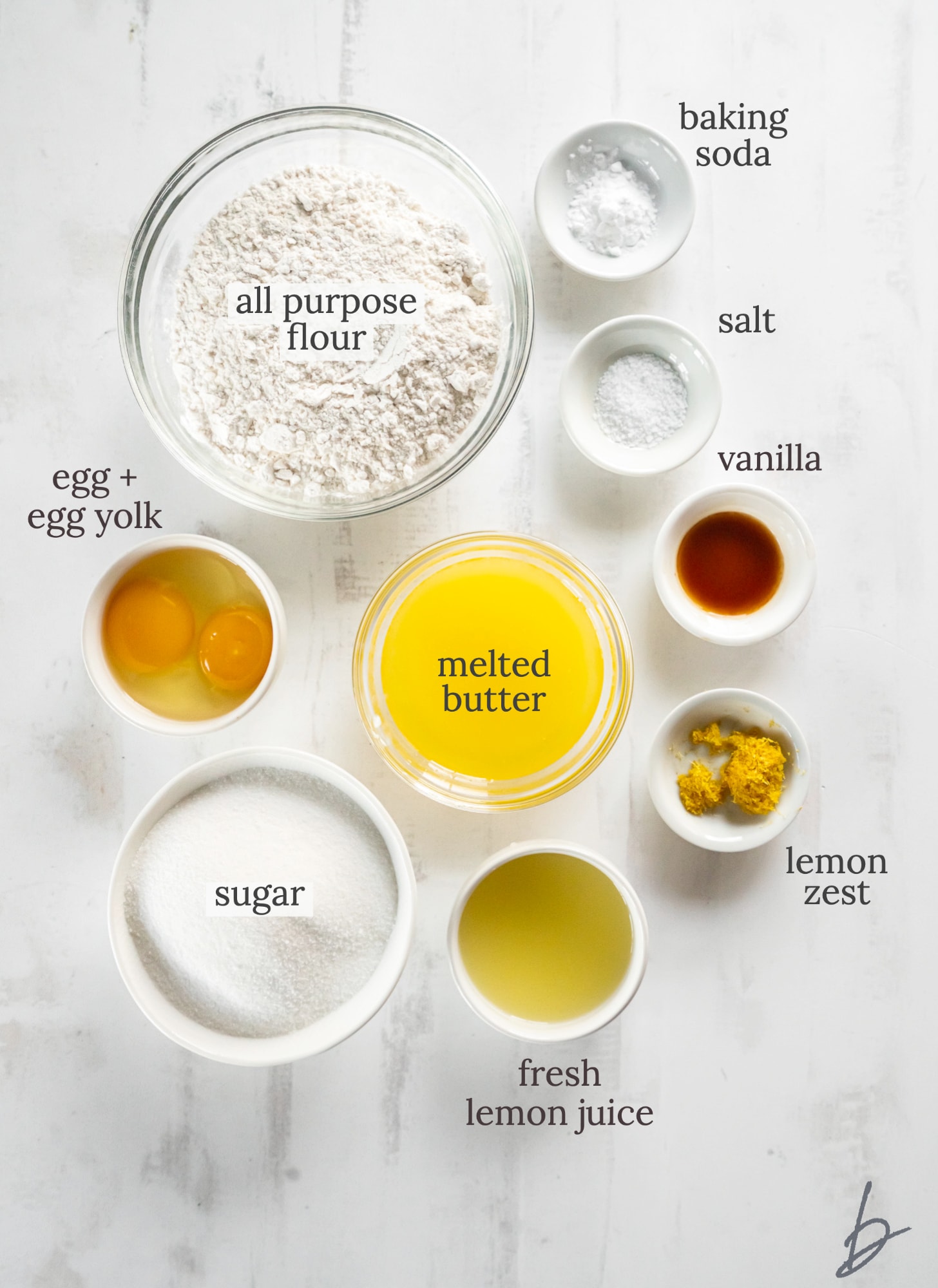 lemon sugar cookie ingredients in bowls labeled with text